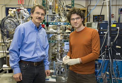 Alex Zettl (left) and Kenneth Jensen, using the same technology with which they created the world’s first fully functional nanotube radio, have created the world’s smallest and most sensitive weighing scale. (Photo by Roy Kaltschmidt, Berkeley Lab Public Affairs)