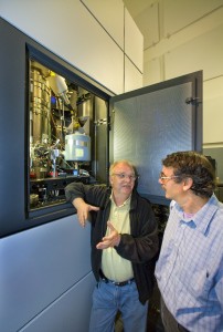 Christian Kisielowski (left) and Alex Zettl, scientists with the Lawrence Berkeley National Laboratory, at the TEAM 0.5 microscope, which enables scientists to see each and every individual atom in a sample, a huge advantage for scientists who study materials and their properties.