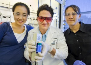 Molecular Foundry post-doctoral scholar Hoi Ri Moon, staff scientist Jeff Urban and Facility Director Delia Milliron demonstrate magnesium oxide nanocrystals that could be a bright candidate for solid-state lighting. (Photo by Roy Kaltschmidt, Berkeley Lab Public Affairs)