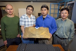 Berkeley researchers (from left) Guy Bartal, Xiaobo Yin,    Lee Fok and Xiang Zhang shown with their acoustic hyperlens which boosts the magnification of sound-based imaging technologies such as ultrasound and underwater sonar by eightfold. (Photo by Roy Kaltschmidt, Berkeley Lab Public Affairs)