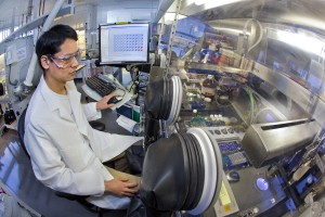 Emory Chan, with Berkeley Lab’s Molecular Foundry, directs WANDA, a revolutionary nanocrystal-making robot, to perform complex workflows that traditionally require extensive chemistry experience. (Photo by Roy Kaltschmidt, Berkeley Lab Public Affairs) 