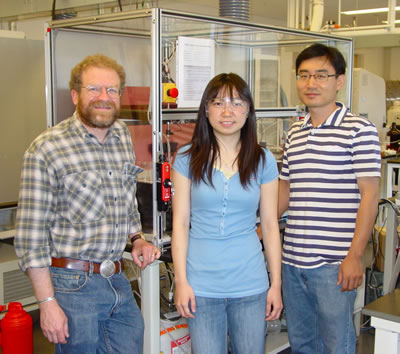 From left, Ron Zuckermann, Tammy Chu and Byoung-Chul Lee in front of a peptoid synthesizer at the Molecular Foundry, which they used to develop nano-sized jaws that mimic proteins.