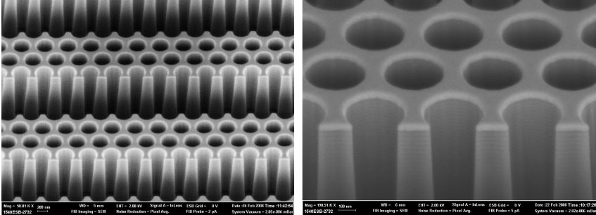 Berkeley Lab scientists have designed a novel device that demonstrates the concept of optical antimatter, in which light travels millimeter distances through matter without distortion.  The electron micscopy image in (a) shows the device’s alternating of space and silicon photonic crystalline material with air holes. The image (b) is a magnified version.