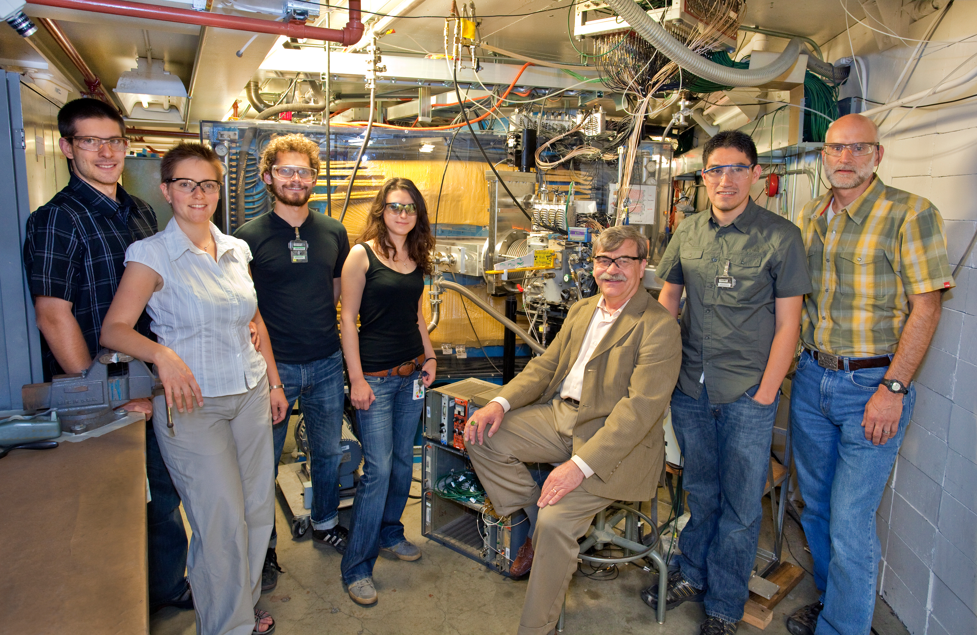 Members of the group that confirmed the production of element 114 in front of the Berkeley Gas-filled Separator at the 88-Inch Cyclotron, from left: Jan Dvorak, Zuzana Dvorakova, Paul Ellison, Irena Dragojevic, Heino Nitsche, Mitch Andre Garcia, and Ken Gregorich. Not pictured in Liv Stavestra. (Photo by Roy Kaltschmidt, Berkeley Lab Creative Services Office. For best resolution, click on image.) 