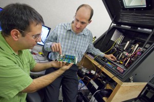 Babak Sanii (left) and Paul Ashby with Berkeley Lab’s Molecular Foundry,  have designed a nanowire-based imaging tool to study living cells and other soft materials in their natural, liquid environment. (Photo by Roy Kaltschmidt, Berkeley Lab Public Affairs)