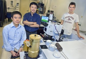 Yongmin Liu (left) Xiang Zhang and Thomas Zentgraf used sophisticated compuer modeling to develop a “transformational plasmon optics” technique that may open the door to practical integrated, compact optical data-processing chips. (Photo by Roy Kaltschmidt, Berkeley Lab Public Affairs)