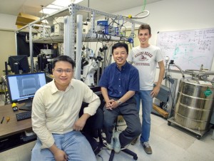 Ming Liu (foreground), Xiang Zhang and Thomas Zentgraf have created the first nano-sized light mill motor whose rotational speed and direction can be controlled by tuning the frequency of the incident light waves. This new concept  opens the door to a broad range of valuable applications in energy and biology as well as in nanoelectromechanical systems. (Photo by Roy Kaltschmidt, Berkeley Lab Public Affairs)