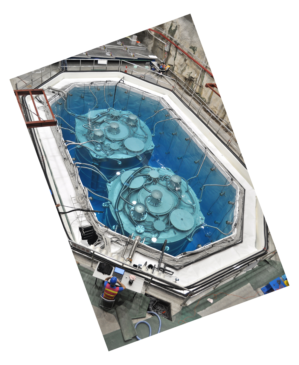 The first detectors now taking data are housed in the experimental hall nearest the two Daya Bay reactors, shown here as the water pool in which the detectors are submerged had been completely filled and before the pool was covered with a sliding roof, instrumented to identify incoming energetic cosmic rays.  (Photo by Joseph Y.K. Hor) 