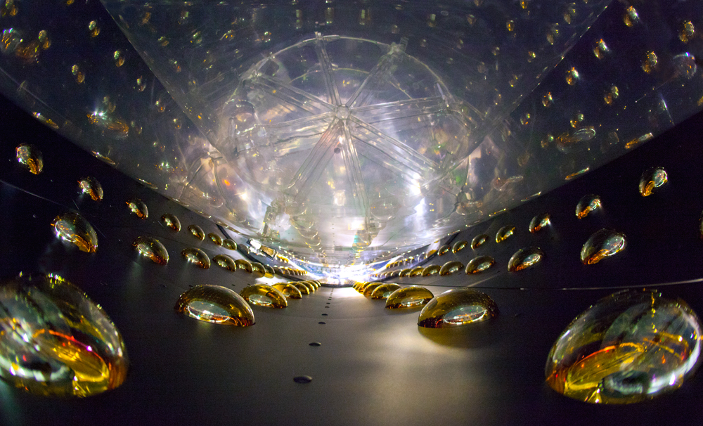 The Daya Bay Reactor Neutrino Experiment captures faint flashes of light that indicate antineutrino interactions in detectors filled with scintillator fluids. Each detectors is lined with photomultiplier tubes. Two detectors have begun collecting data, two more have been completed, and four are under construction. (Photo by Roy Kaltschmidt, Berkeley Lab Public Affairs)