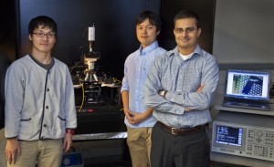  (From left) Kuniharu Takei, Toshitake Takahashi and Ali Javey at the microscope electric probe station used to characterize flexible and stretchable backplanes for e-skin and other electronic devices. (Photo by Roy Kaltschmidt, Berkeley Lab)