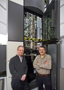 Berkeley Lab director Paul Alivisatos (left) and physicist Alex Zettl at TEAM I, the world’s most powerful electron microscope, where a they led a collaboration that produced the first atomic-scale, real-time movies of nanocrystal growth in liquids. (Photo by Roy Kaltschmidt, Berkeley Lab)
