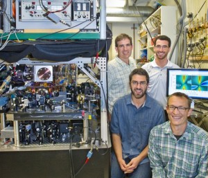 (Clockwise) Nathan Brahms, Dan Brooks, Dan Stamper-Kurn and Thierry Botter used their unique ultracold atoms laser system to record the first direct observation of distinctly quantum  effects in an optomechanical system. (Photo by Roy Kaltschmidt)