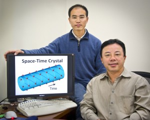 Xiang Zhang (seated) and Tongcang Li have proposed a way to make a four-dimensional space-time crystal, a device that could be used to study the many-body problem of physics and other quantum phenonomena. (Photo by Roy Kaltschmidt, Berkeley Lab)