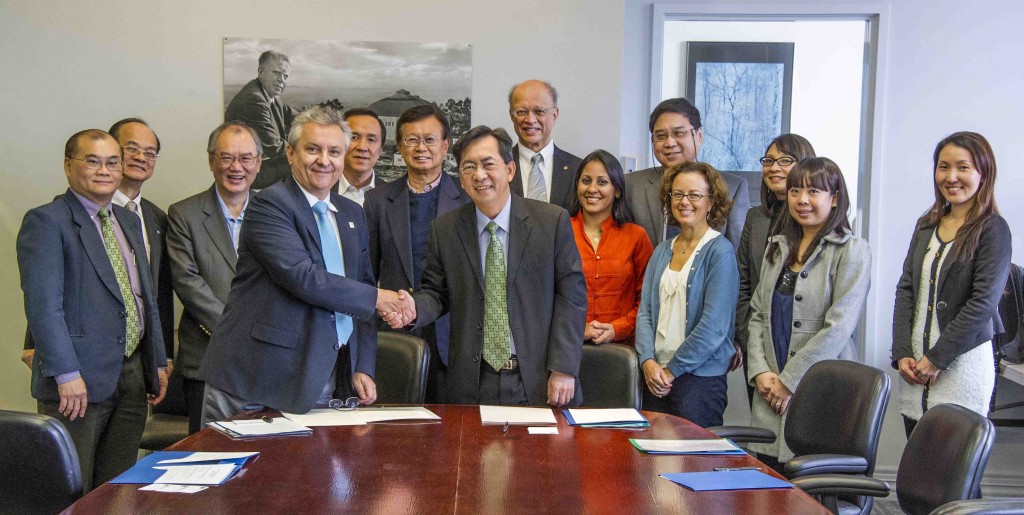 Horst Simon, Berkeley Lab Deputy Director and Dr. John Keung, BCA CEO signing with EETD members in attendance - Ashok Gadgil, Reshma Singh and Cindy Regnier.