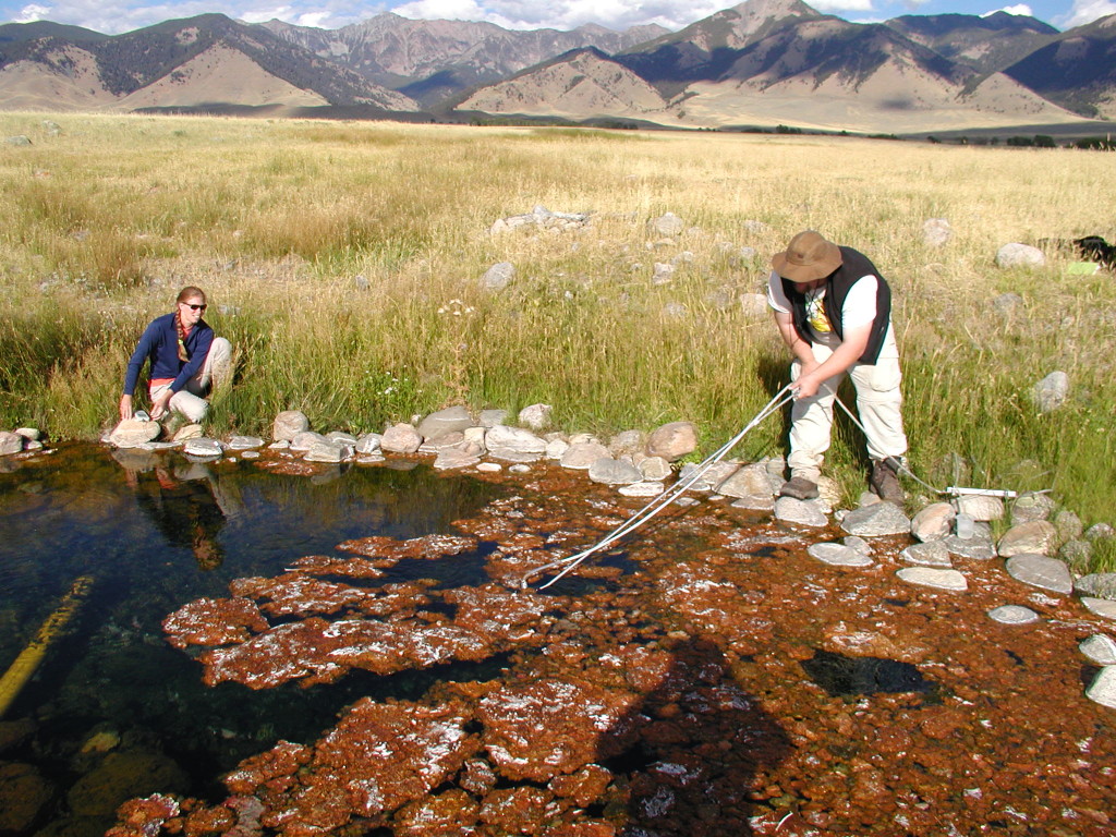 Scientists collect water samples from a hot spring near Dixie Valley, Nevada. Berkeley Lab scientists are developing a computer program that calculates the temperature of subsurface geothermal reservoirs that feed such springs. 