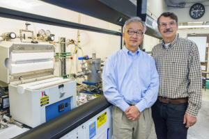 Luke Lee (left) and Alex Zettl led the creation of the world’s first graphene nanopores with a “built-in” optical antenna. (Photo by Roy Kaltschmidt)