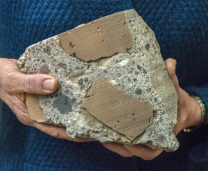 Ancient Roman concrete consists of coarse chunks of volcanic tuff and brick bound together by a volcanic ash-lime mortar that resists microcracking, a key to its longevity and endurance. (Photo by Roy Kaltschmidt, Berkeley Lab)