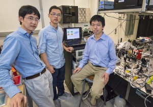 (From left) Long Ju, Zhiwen Shi and Feng Wang used near-field IR nanoscopy to discover topologically protected 1D electron conducting channels at the domain walls of bilayer graphene. (Photo by Roy Kaltschmidt)