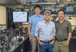 Taiki Hatakeyama, Michael Mrejen and Xiang Zhang are part of a team that developed a technique to control light in closely packed nanoscale waveguides for integrated photonic circuitry. (Photo by Roy Kaltschmidt) 