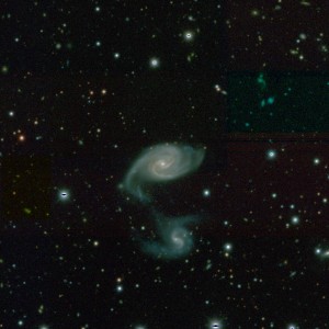 A DeCAM/DeCALs image of galaxies observed by the Blanco Telescope. The Legacy Survey is producing an inference model catalog of the sky from a set of optical and infrared imaging data, comprising 14,000 deg² of extragalactic sky visible from the northern hemisphere in three optical bands and four infrared bands. (Image: Dark Energy Sky Survey)