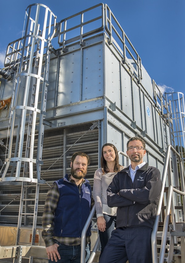 (from left) Chris Weyandt, Deirdre Carter and John Elliott helped implement an online monitoring system for water cooling towers like this one at Bldg. 71.