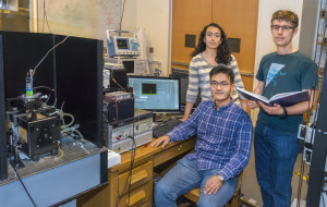 (From left) Claudia Avalos, Keunhong Jeong and Jonathan King were part of a team led by Alex Pines that used microwaves to enhance NMR/MRI signal sensitivity many orders of magnitude above what is ordinarily possible with conventional NMR/MRI magnets at room temperature. (Photo by Roy Kaltschmidt)