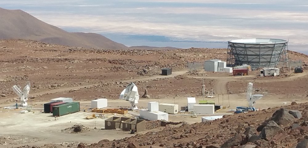 Photo - The Simons Array will be located in Chile's High Atacama Desert, at an elevation of about 17,000 feet. The site currently hosts the Atacama Cosmology Telescope (bowl-shaped structure at upper right) and the Simons Array (the three telescopes at the bottom left, middle and right). The Simons Observatory will incorporate several new telescopes and set the stage for a next-generation experiment. (University of Pennsylvania)