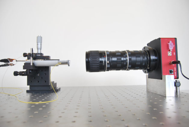 Photo - A camera test of a robotic fiber-optic positioner that will be tested in ProtoDESI. (Credit: MNRAS, DOI: 10.1093/mnras/stv541)