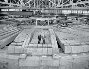 Photo - This historic photo shows two Berkeley Lab physicists standing on the shielding of the Bevatron, which was used in cancer treatments and high-energy physics experiments. (Credit: Berkeley Lab)