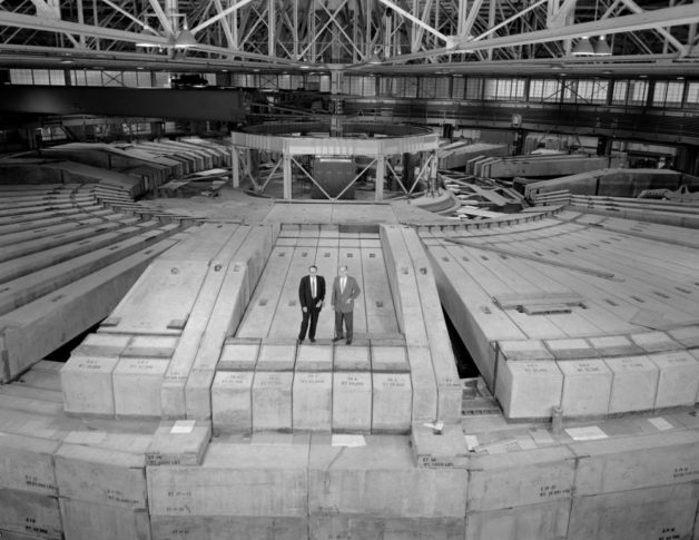 Photo - Then-Berkeley Lab Director Edwin McMillan, left, and Bevatron Group Leader Ed Lofgren, stand atop the 7-feet-thick concrete shielding at the remodeled Bevatron in this 1963 photo. (Credit: Berkeley Lab)