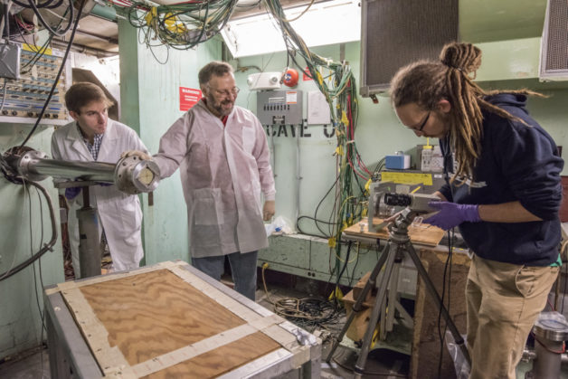 Photo - Lee Bernstein (center) works with UC Berkeley graduate students Andrew Voyles (left) and Alexander Springer (right) to prepare for an experiment in Cave 0 at Berkeley Lab’s 88-Inch Cyclotron.