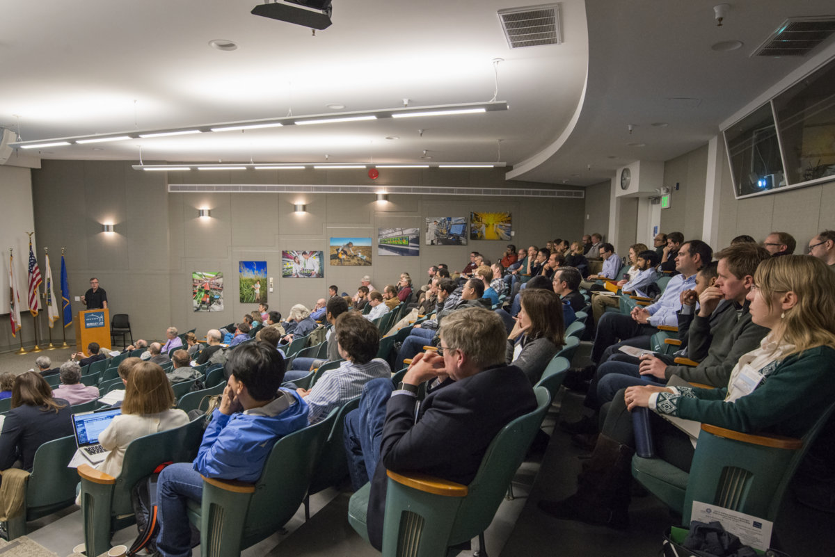 Photo - Howard Padmore, at podium, who leads the Experimental Systems Group at Berkeley Lab’s ALS, discusses science possibilities for a planned ALS upgrade project. (Credit: Marilyn Chung/Berkeley Lab)