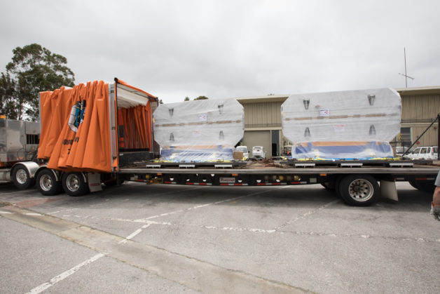 Photo - The first undulators—devices that will be used to produce X-ray laser beams for a project known as LCLS-II—arrived at SLAC National Accelerator Laboratory in Menlo Park on Wednesday. (Credit: SLAC)