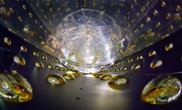 Photo - A view inside the particle detectors at Daya Bay, where photomultiplier tubes measure signals from antineutrinos. (Credit: Roy Kaltschmidt/Berkeley Lab)