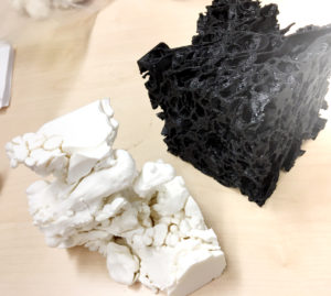 Image - These 3-D printed models show a magnified sample of pumice (black) and a large concentration of gas (white) filling interconnected pores within that pumice sample. (Credit: Berkeley Lab)