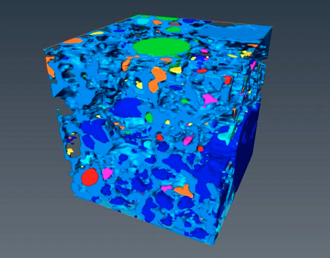 Image - This 3-D rendering, produced using X-ray microtomography at Berkeley Lab’s Advanced Light Source, shows a cube-shaped sample of pumice (blue-gray) and pockets of trapped gases (other colors). (Credit: Berkeley Lab, UC Berkeley)