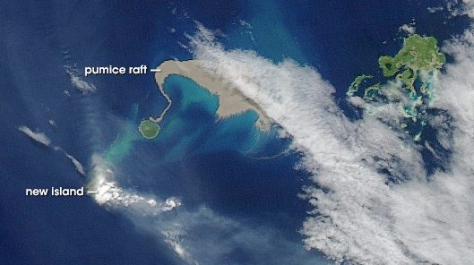 Image - In this 2006 image, a “raft” of floating pumice (beige) appears in satellite images following a volcanic eruption in the Tonga Islands. (Credit: Jesse Alan/NASA Earth Observatory, Goddard Space Flight Center)