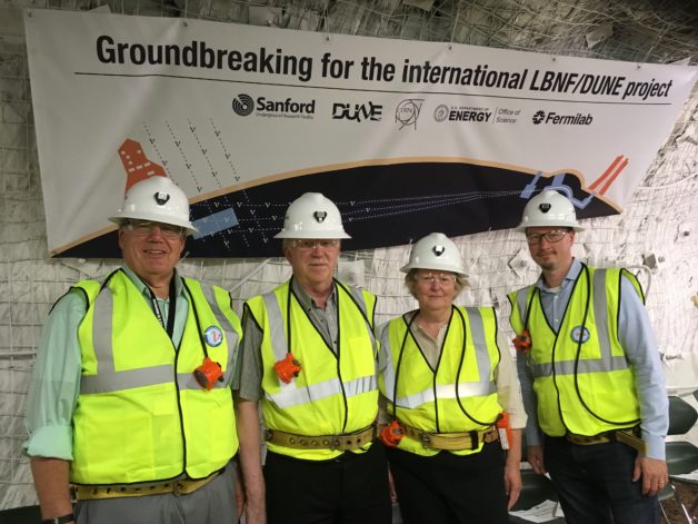 Photo - Berkeley Lab’s Kem Robinson, left, participates in a July 21 tour of the underground site where a new neutrino experiment will be constructed. Also pictured (from left to righ) are David MacFarlane of SLAC National Accelerator Laboratory, chairperson of the Long Baseline Neutrino Committee (LBNC); Fermi National Accelerator Laboratory’s Elaine McCluskey, the Long Baseline Neutrino Facility’s project manager; and Tim Meyer, Fermilab’s chief operating officer. Robinson, laboratory project management officer at Berkeley Lab, is a member of the LCBNC. (Credit: Kem Robinson/Berkeley Lab)