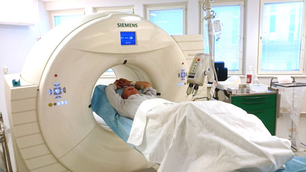 Image - A patient enters a positron emission tomography/computed tomography (PET/CT) scanner. (Credit: Wikimedia Commons)