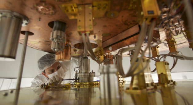 Image - A researcher works on the cryostat unit for CUORE during the assembly process. (Credit: CUORE collaboration)
