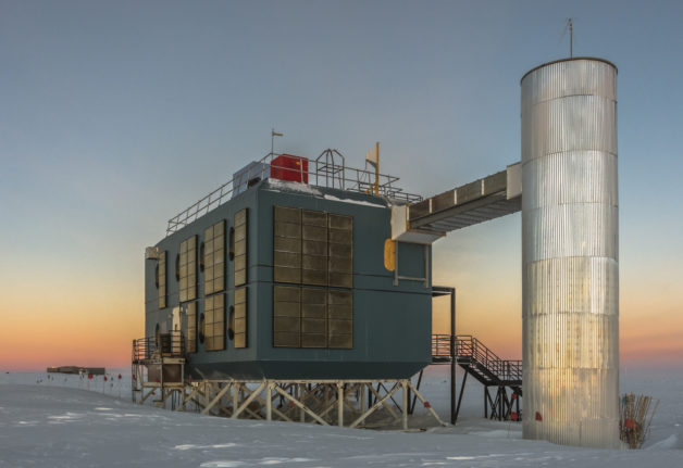 Photo - The IceCube Lab in March 2017, with the South Pole station in the background. (Credit: IceCube Collaboration)