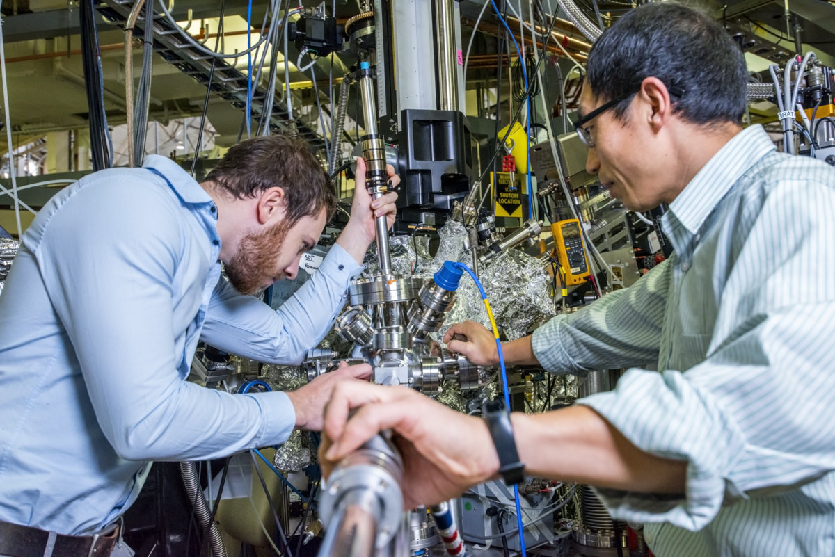 Photo - Will Gent, left, and Wanli Yang, work on instruments at the iRIXS endstation, part of Berkeley Lab's Advanced Light Source. The endstation was key in a battery cathode study. (Credit: Marilyn Chung/Berkeley Lab)