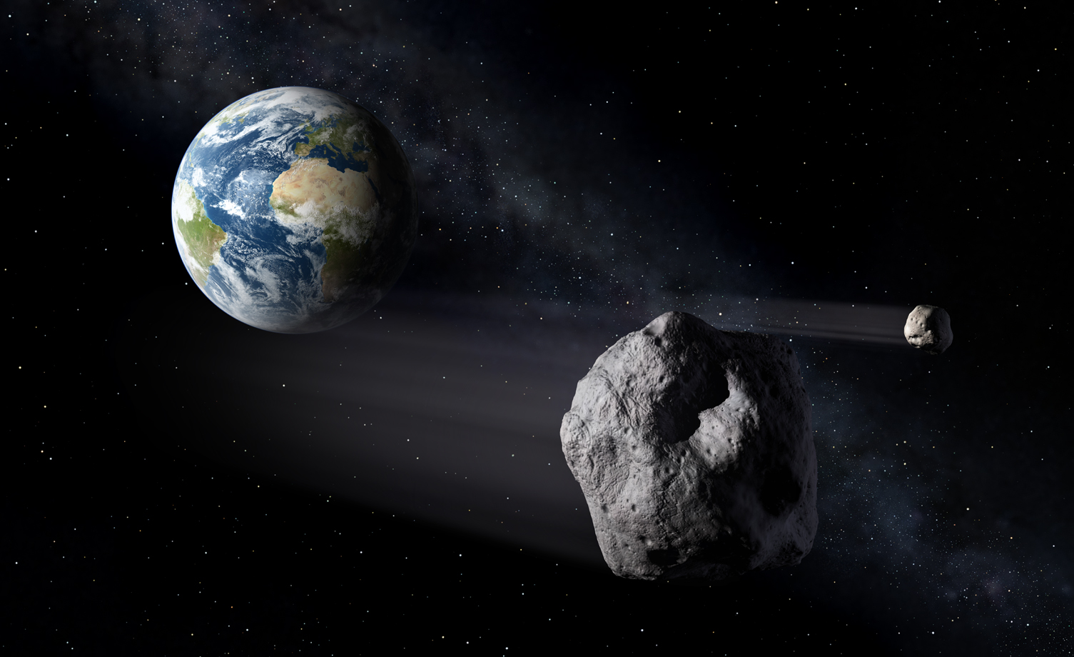 Illustration - Asteroids pass close to Earth in this illustration. NASA is partnering with Berkeley Lab to study meteorite materials to better understand how meteors fracture as they enter Earth’s atmosphere and assess the risks they pose. (Credit: ESA/P.Carril)