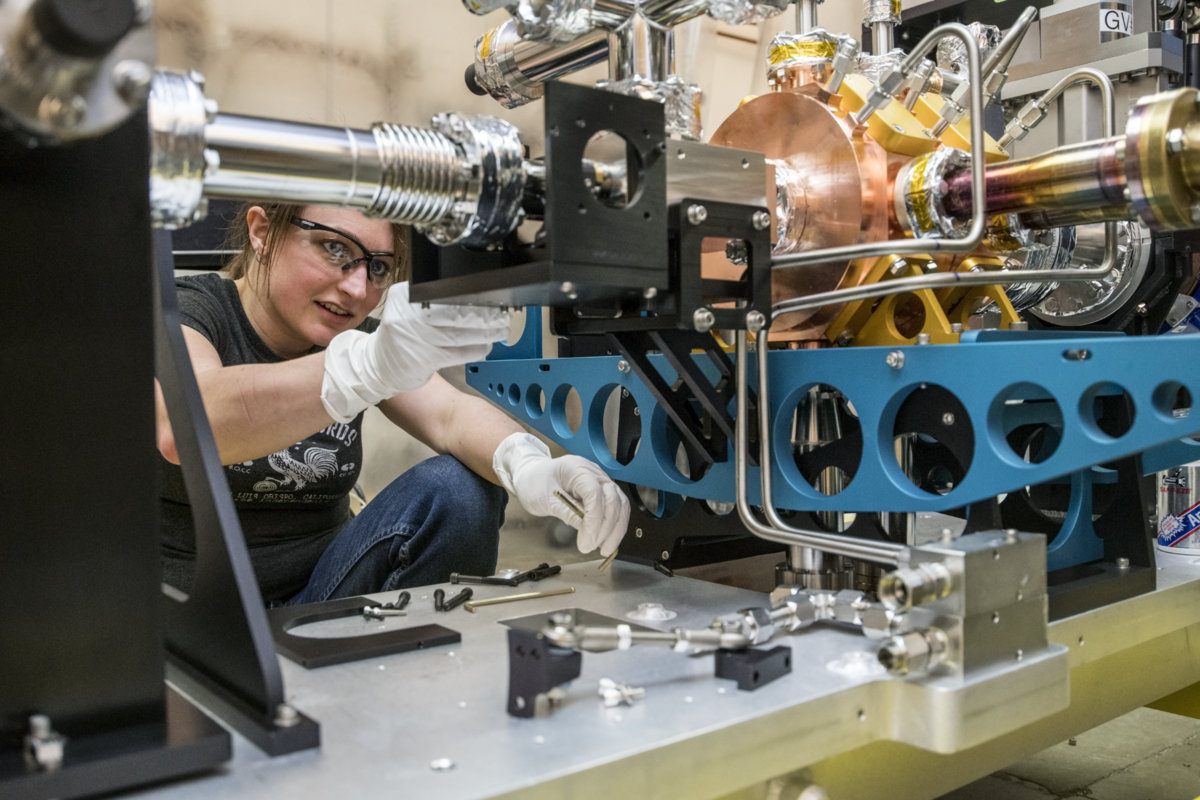 Photo - Krista WIlliams, mechanical technician, works on the final assembly of LCLS-II injector components on Jan. 11. (Credit: Marilyn Chung/Berkeley Lab)