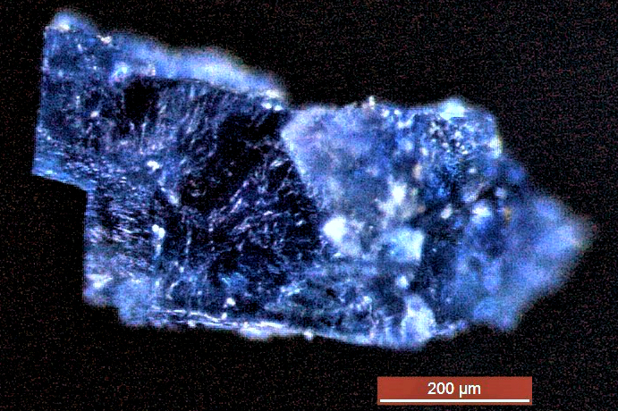 Image - A blue crystal recovered from a meteorite that fell near Morocco in 1998. (Credit: Queenie Chan/The Open University, U.K.)