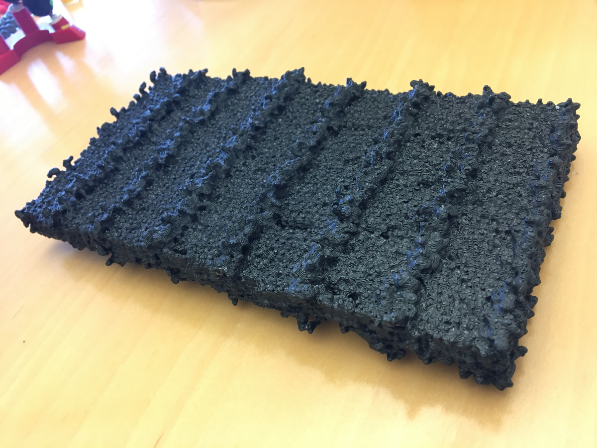 Photo - A 3-D-printed model of a peptoid nanosheet, showing patterned rows of sugars. (Credit: Berkeley Lab)