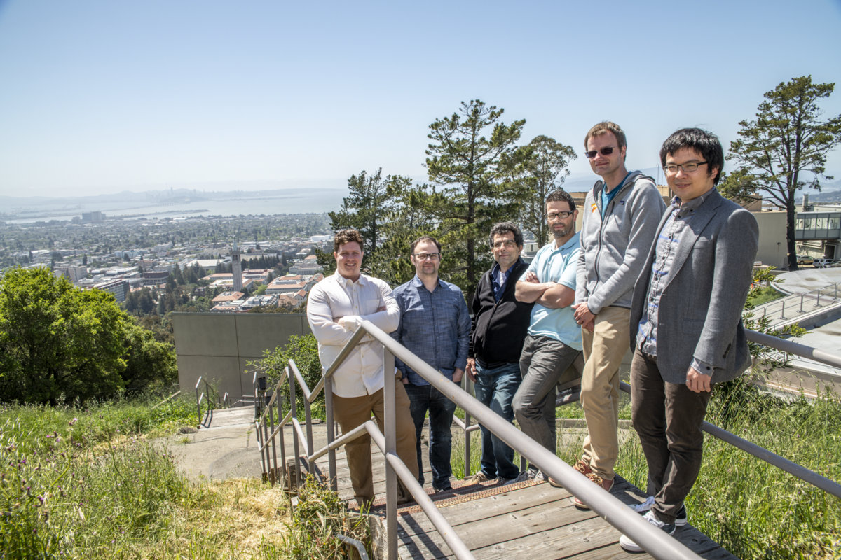 Photo - From left: David Brantley, André Walker-Loud, Pavlos Vranas, Henry Monge-Camacho, Thorsten Kurth, Chia Cheng “Jason” Chang, members of a team that calculated the nucleon axial coupling, a property important to understanding the neutron lifetime, gathered at Berkeley Lab in April. (Credit: Marilyn Chung/Berkeley Lab)