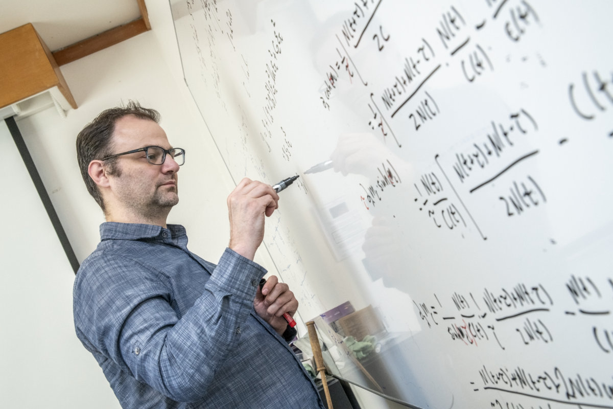 Photo - André Walker-Loud, a staff scientist at Berkeley Lab, led a study that calculated a property central to understanding the lifetime of neutrons. (Credit: Marilyn Chung/Berkeley Lab)
