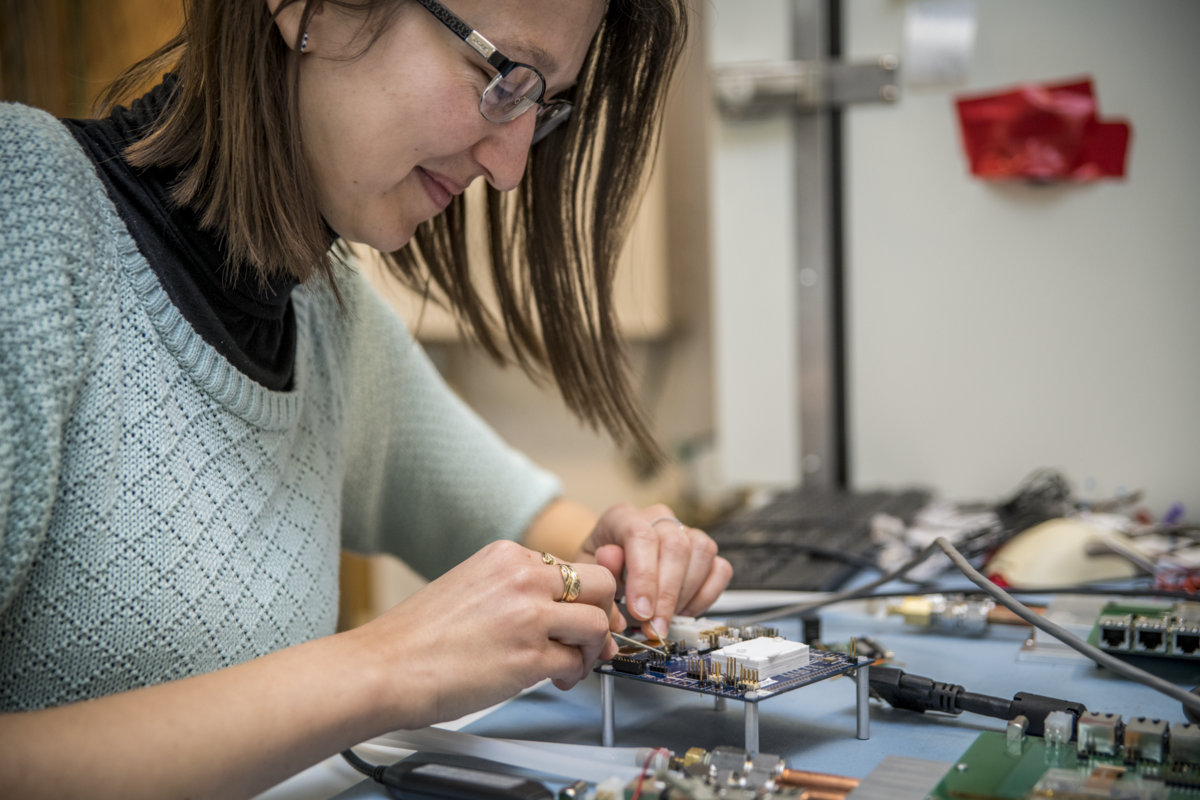 Photo - Aleksandra Dimitrievska works on prototype chips for a planned upgrade at CERN's Large Hadron Collider. (Credit: Marilyn Chung/Berkeley Lab)