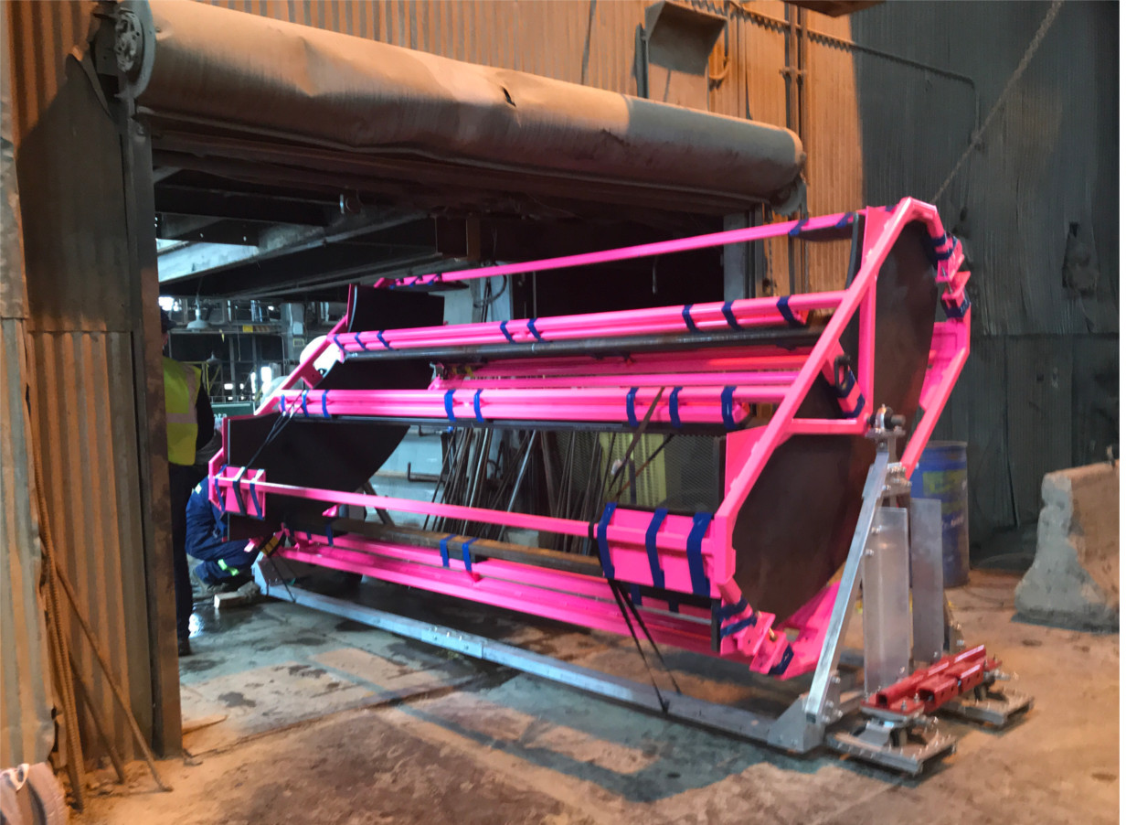 Photo - A sturdy, custom-designed pink frame holds one of the 12-foot-tall acrylic tanks. (Credit: LZ Collaboration)